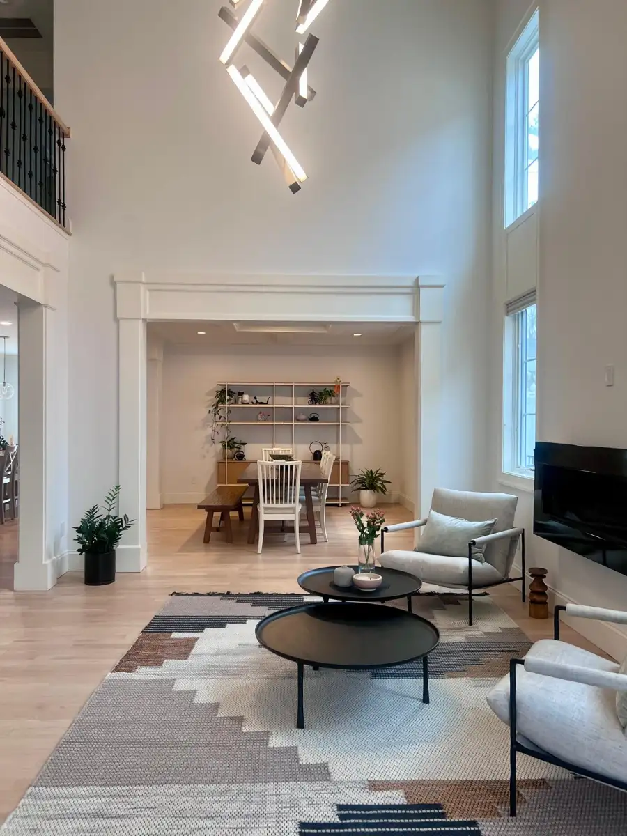 Double-height great room with a sculptural chandelier